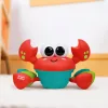 Bright STARTS Zenei és Multiszenzoros Játék Rockin' Crawling Crab™ - Piros, 6 hónapos kortól #17635-010